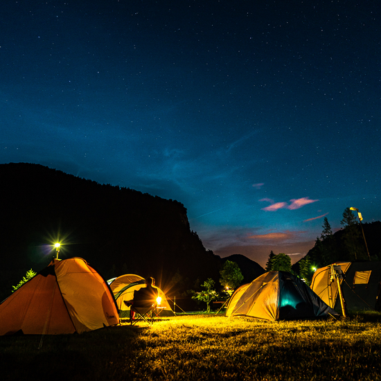 Tents pitched on a campground at night